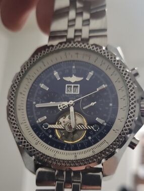 Breitling Silver Watch with Blue Dial and Open Heart